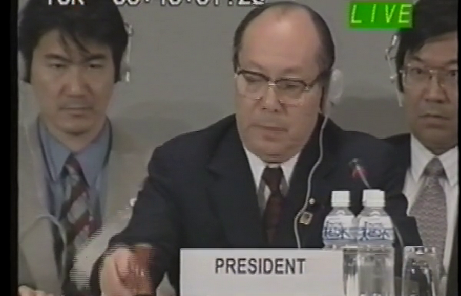 Mr. Hiroshi Ohki, the President of COP 3, bangs the gavel to mark the adoption of the Kyoto Protocol text on 12 December 1997