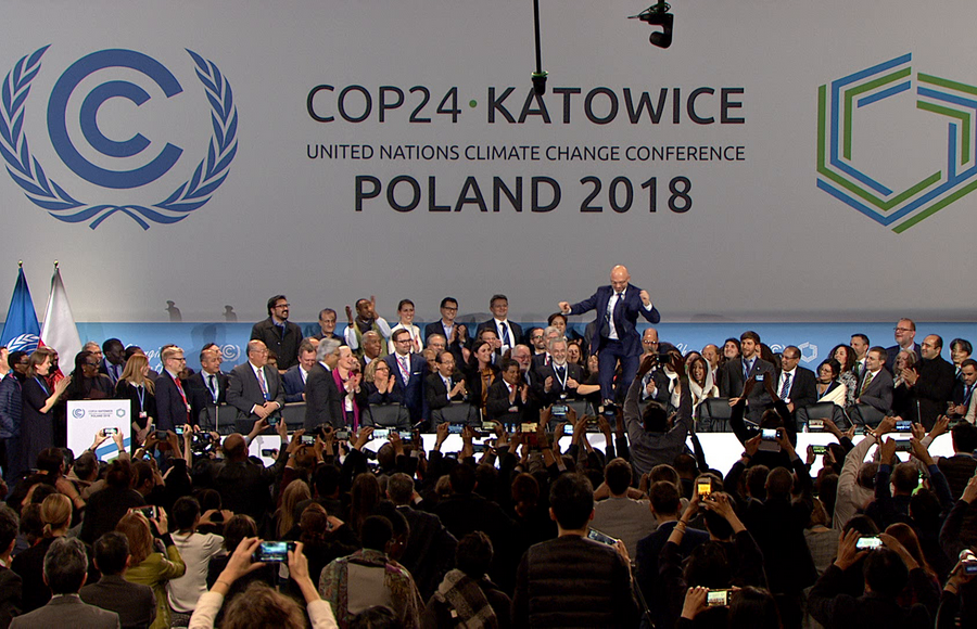 COP 24 President Michał Kurtyka celebrates the adoption of the Katowice Climate Package at the Closing Plenary on 15 December 2018